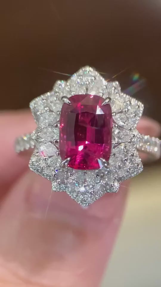 Cushion ruby center, DEF color VVS/VS+ diamonds, floral-inspired halo, available in 14KT/18KT gold and platinum.