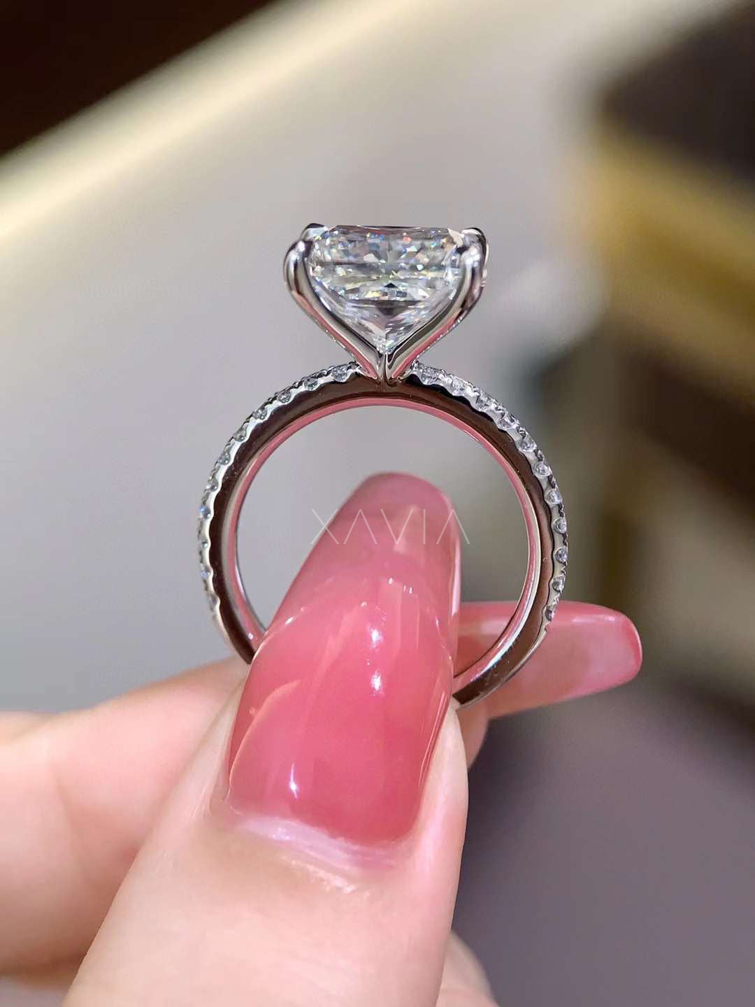 close side angle of princess cut lab grown diamond engagement ring showing elevated cathedral mount and pavé diamonds along band