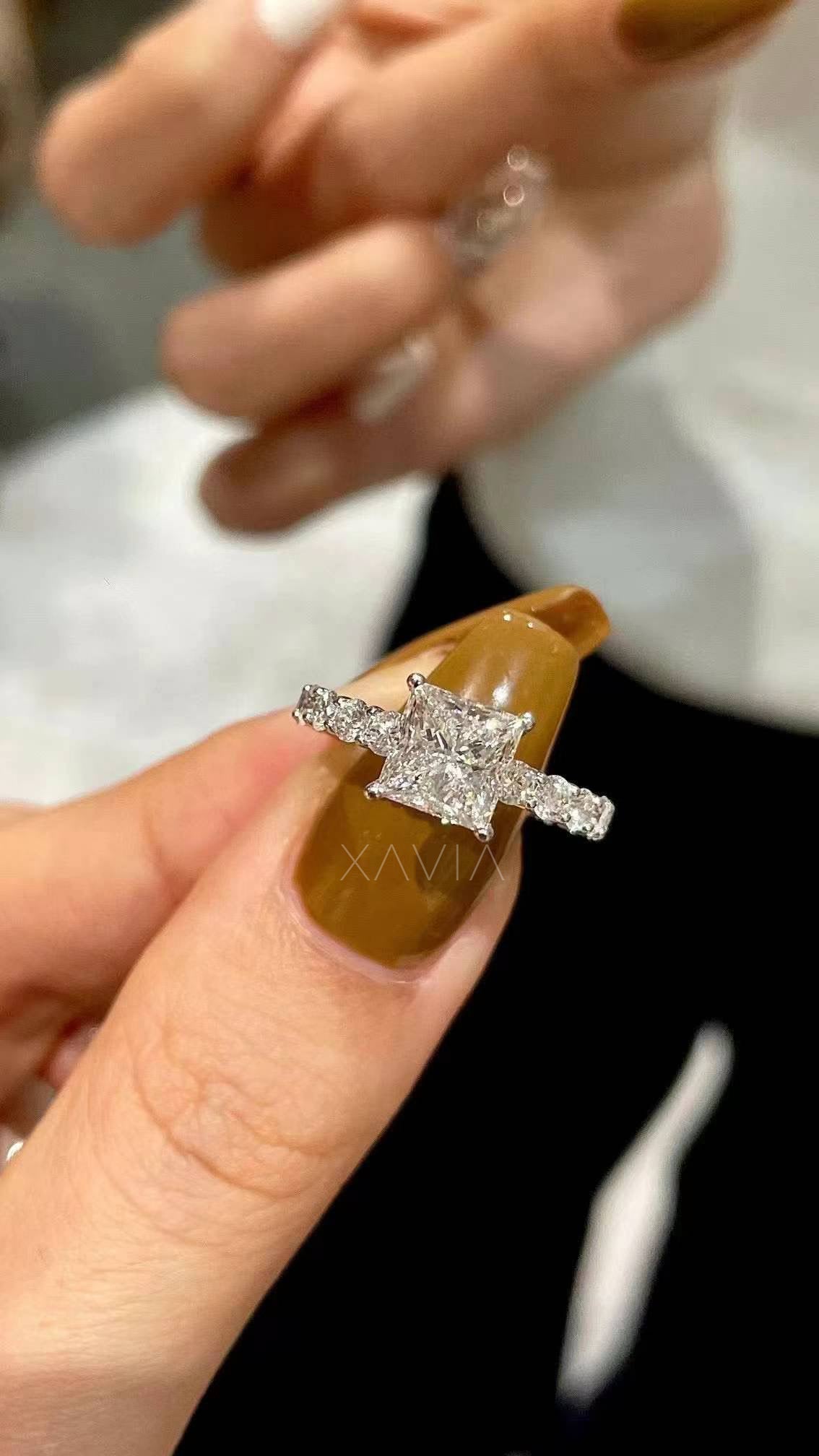 top view of princess cut solitaire lab diamond engagement ring with pavé band in polished white gold