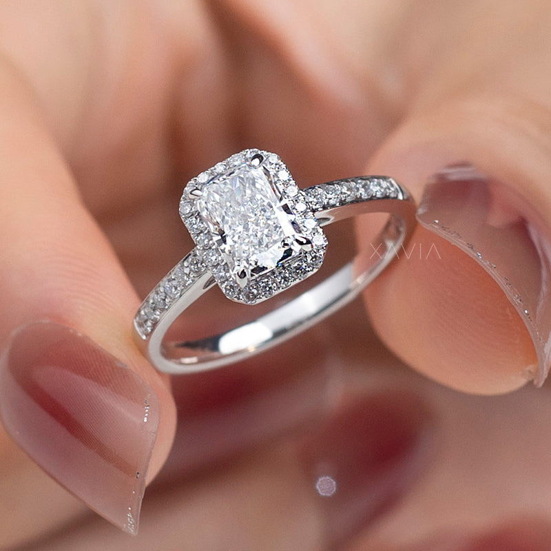Angled close-up of radiant cut lab diamond engagement ring with cushion halo and micro pavé band highlighting brilliant sparkle and refined setting
