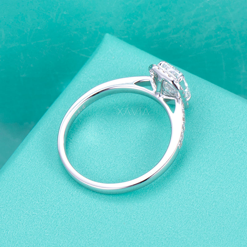 Detailed side gallery view of radiant cut halo lab grown diamond engagement ring showing open gallery structure and pavé shoulders in polished metal