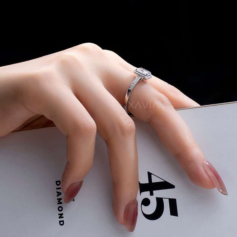 Lifestyle hand shot showing radiant cut lab grown diamond halo ring with slim pavé band highlighting brilliance and elegant engagement ring proportions