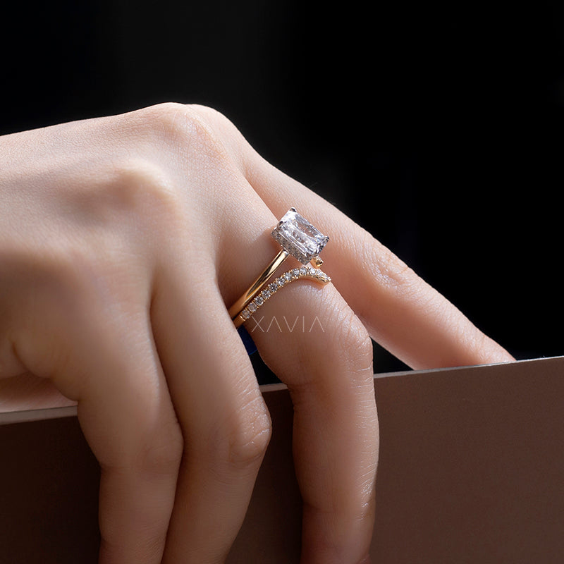 Top angled view of radiant cut lab grown diamond engagement ring with sculptural open bypass gold design