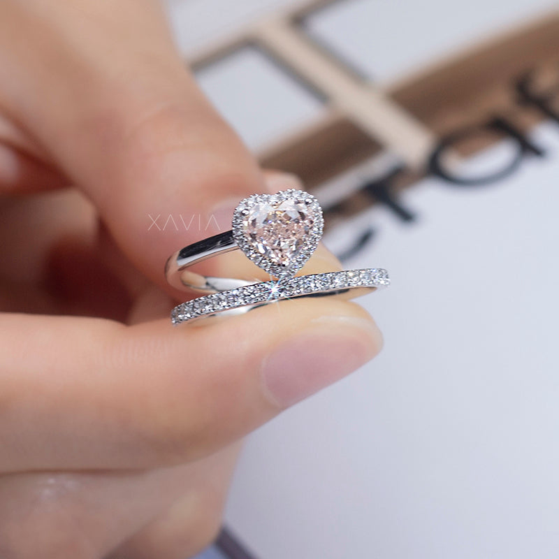 romantic white gold bridal ring set with halo heart diamond engagement ring and matching pavé eternity band