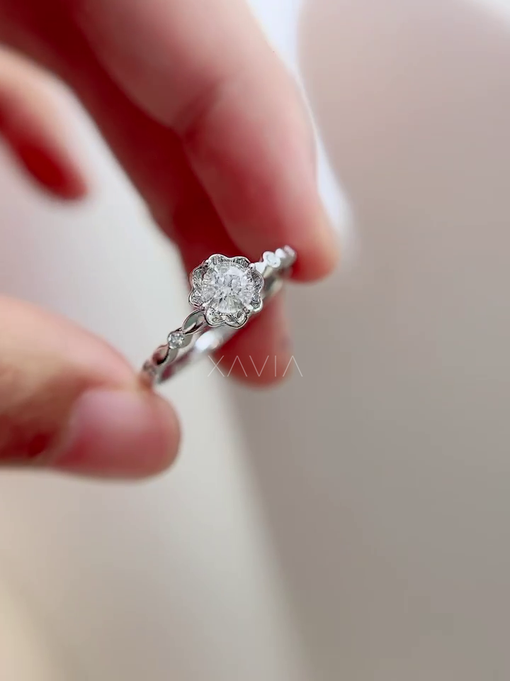 Front angled view of Roselith halo diamond ring featuring round brilliant lab diamond, symmetrical floral halo, and elegant handcrafted detailing.