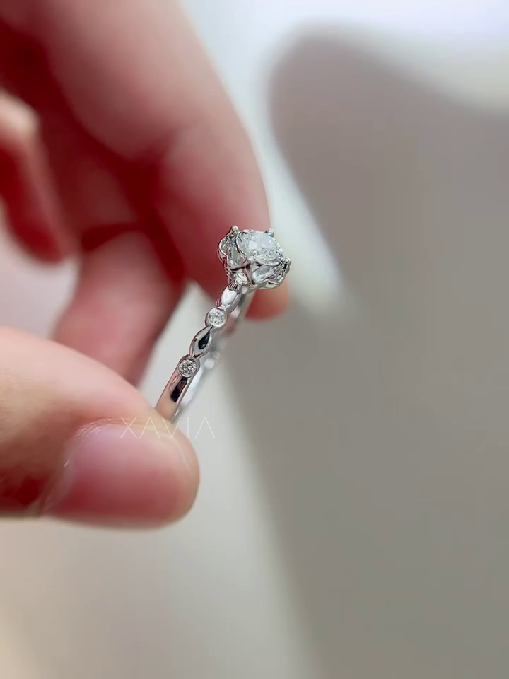 Detailed close-up of Roselith sculpted band with round accent diamonds, high-polish finish, and smooth luxury craftsmanship.