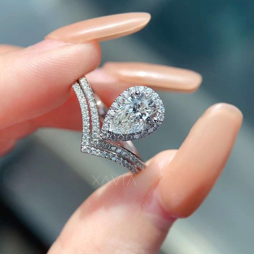 Floral double halo engagement ring worn on hand