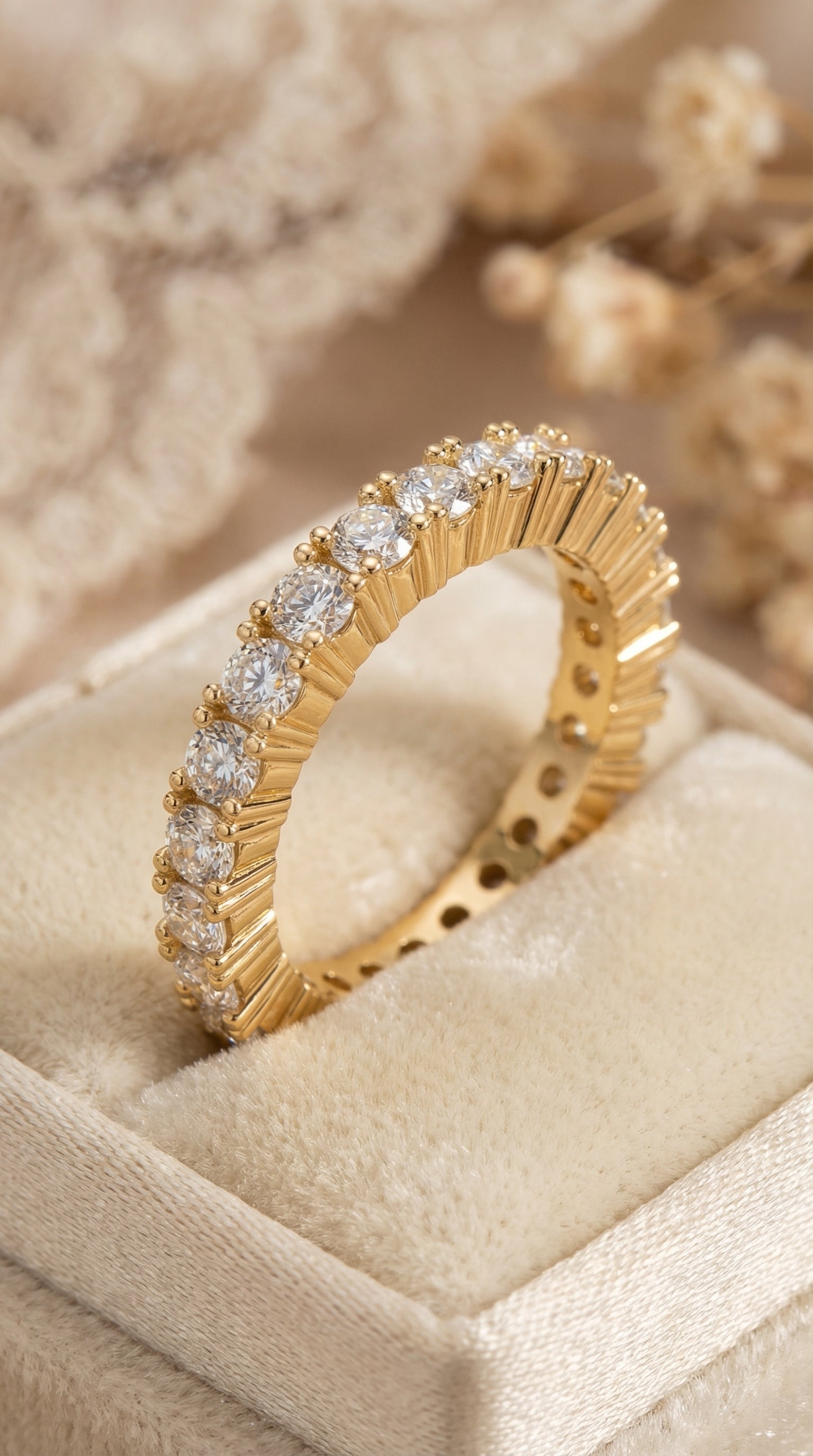 luxury eternity band featuring round brilliant lab grown diamonds displayed upright in jewelry box showing sculpted fluted gold structure and continuous diamond row