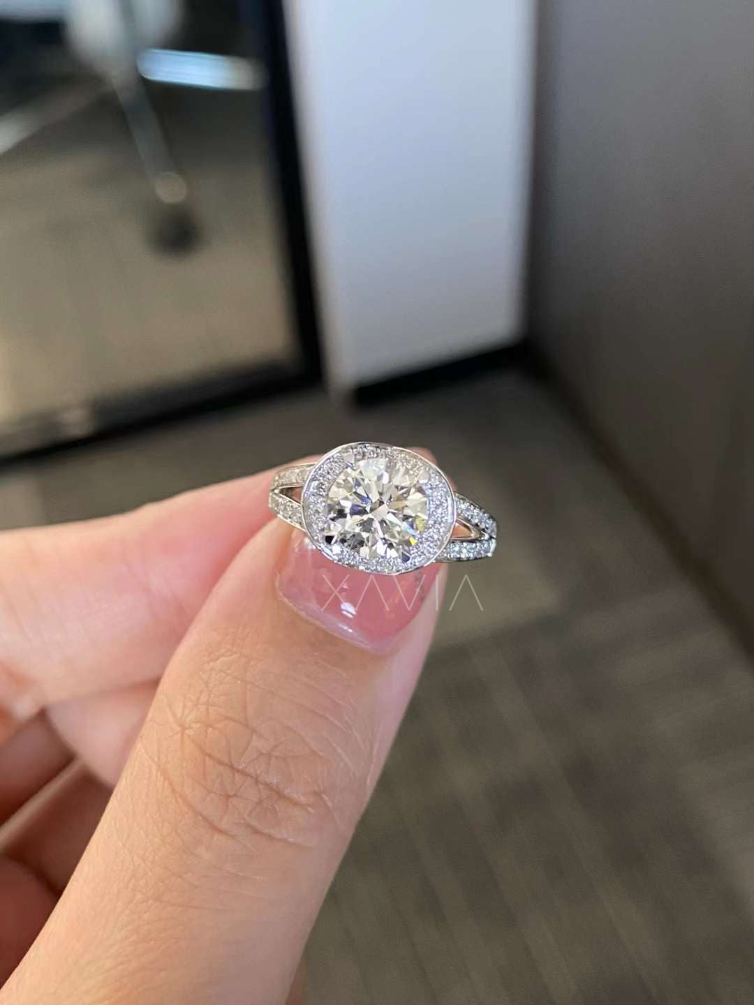 round brilliant cut lab diamond halo engagement ring with split shank pavé band shown on hand