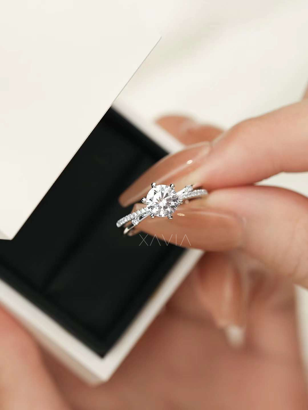 luxury round cut lab diamond solitaire engagement ring with pavé split band inside white jewelry gift box