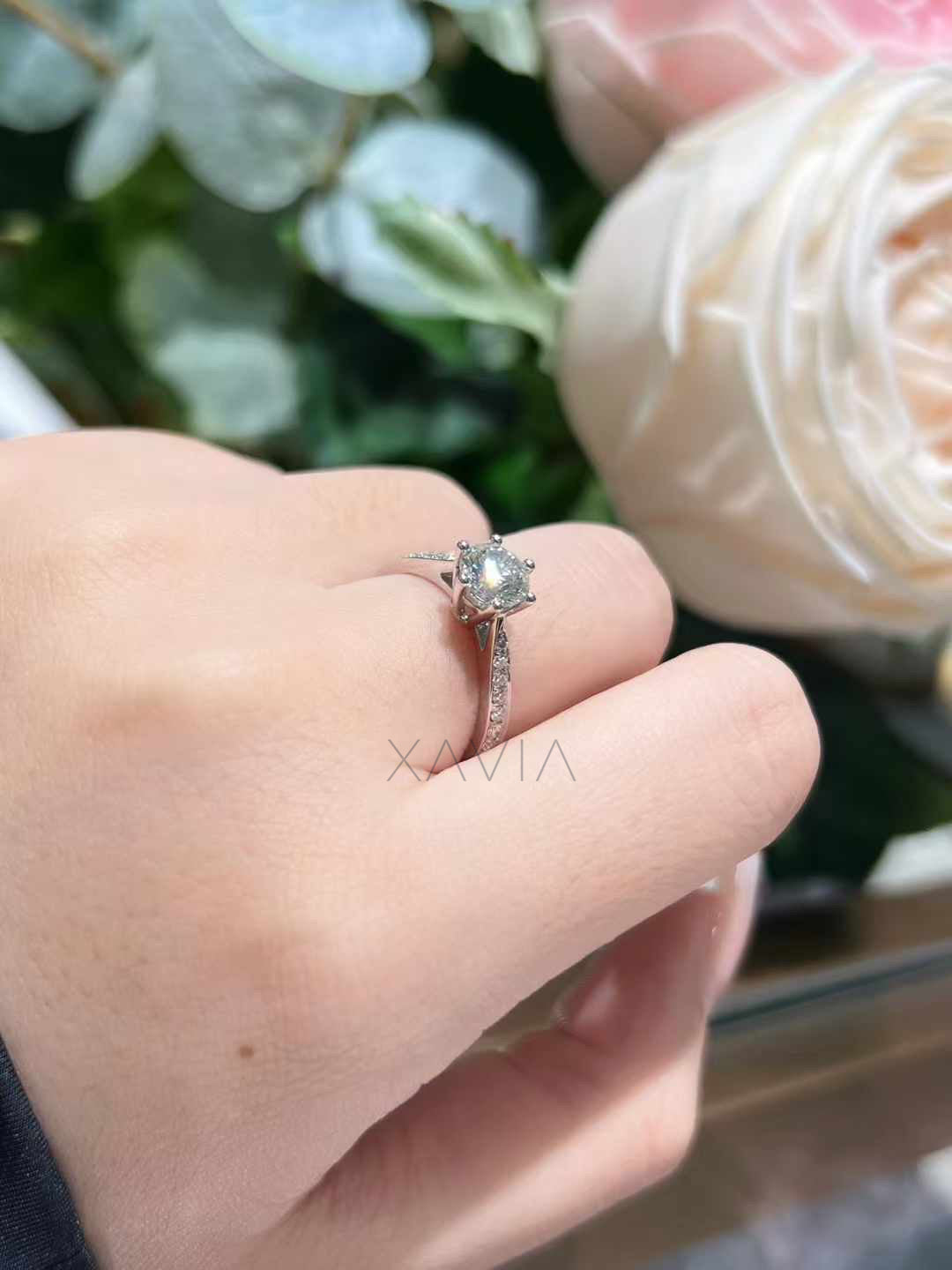 round brilliant lab grown diamond engagement ring with pavé diamond band worn on hand demonstrating elegant cathedral setting sparkle and delicate minimalist design