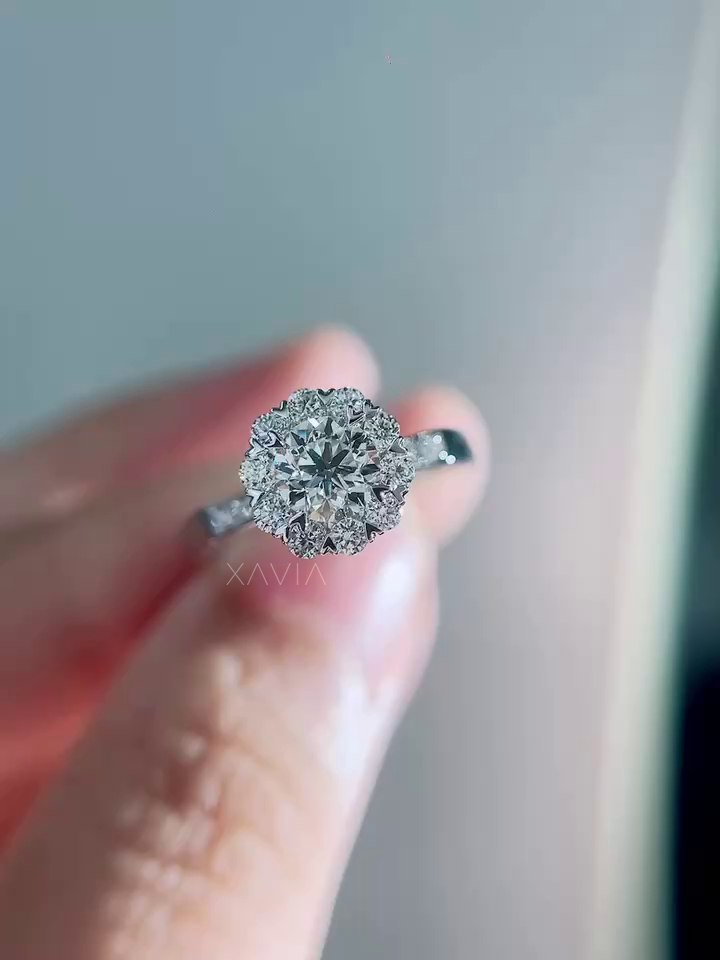 Front view of round brilliant lab grown diamond engagement ring with floral halo cluster and pavé diamond band photographed in soft natural lighting