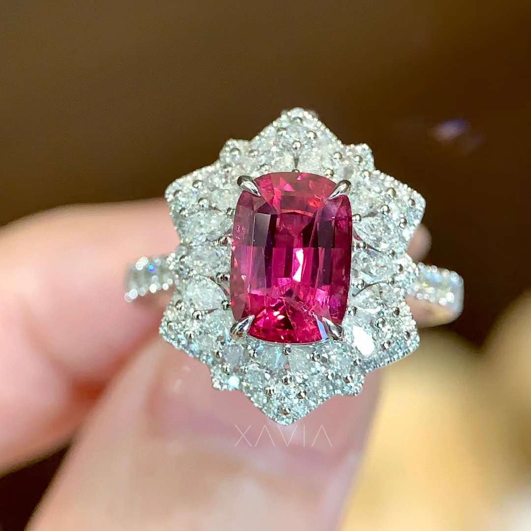 Cushion ruby halo diamond ring presented in luxury velvet gift box, white gold pavé band and floral design