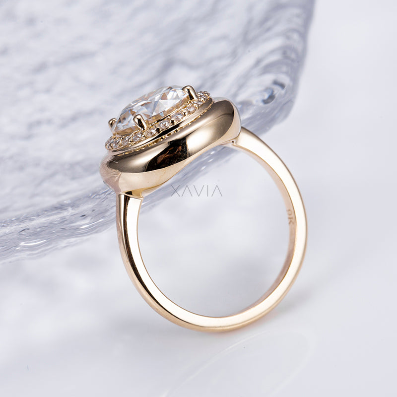 side angle showing domed bezel setting with pavé halo lab diamond ring in yellow gold high-polish band
