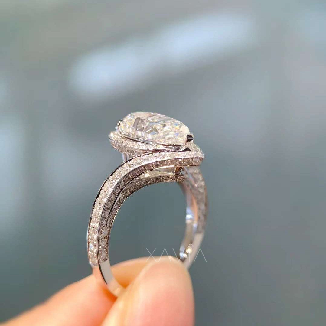 side profile view of twisted pavé pear diamond ring