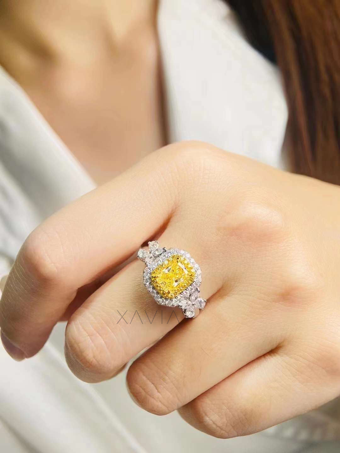 side profile of fancy vivid yellow cushion cut diamond halo ring with pavé setting and marquise floral accents in platinum