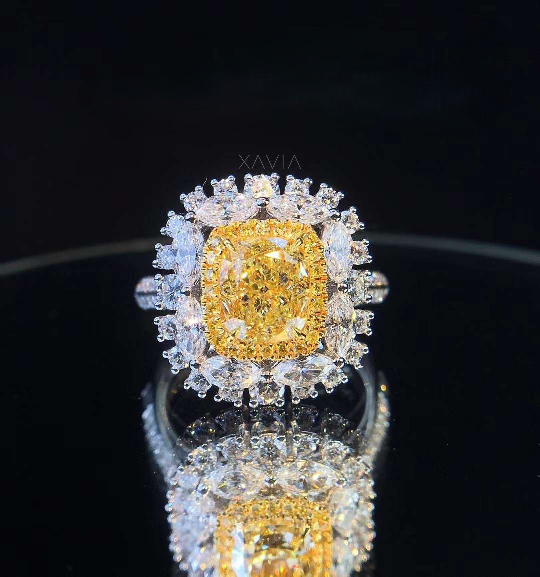 Angled reflective view of fancy yellow cushion cut lab diamond halo ring showing layered brilliance and high polish metal craftsmanship