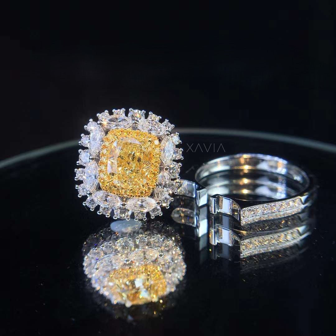 Fancy yellow cushion cut lab diamond halo ring shown with matching pavé diamond band demonstrating bridal set compatibility