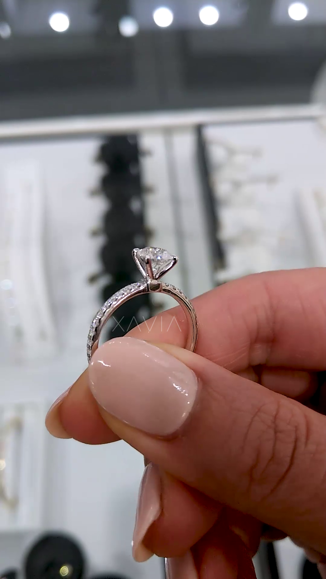 round diamond solitaire engagement ring stacked with matching pavé wedding band showing bridal set styling and enhanced brilliance on hand