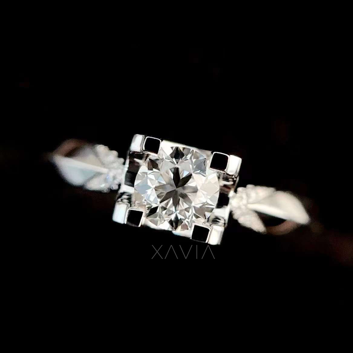 Angled perspective of round cut lab diamond engagement ring highlighting twisted split shank pavé detailing and high polish finish
