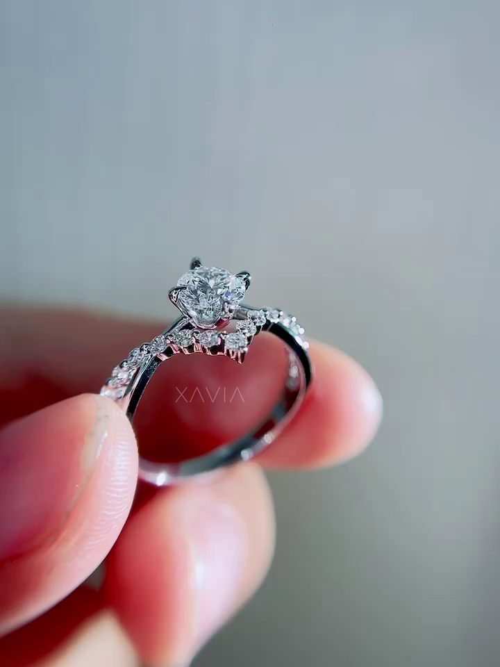 Three quarter angle view of luxury round cut lab diamond engagement ring highlighting floral pavé cluster, twisted vine band and refined sparkle from multiple angles