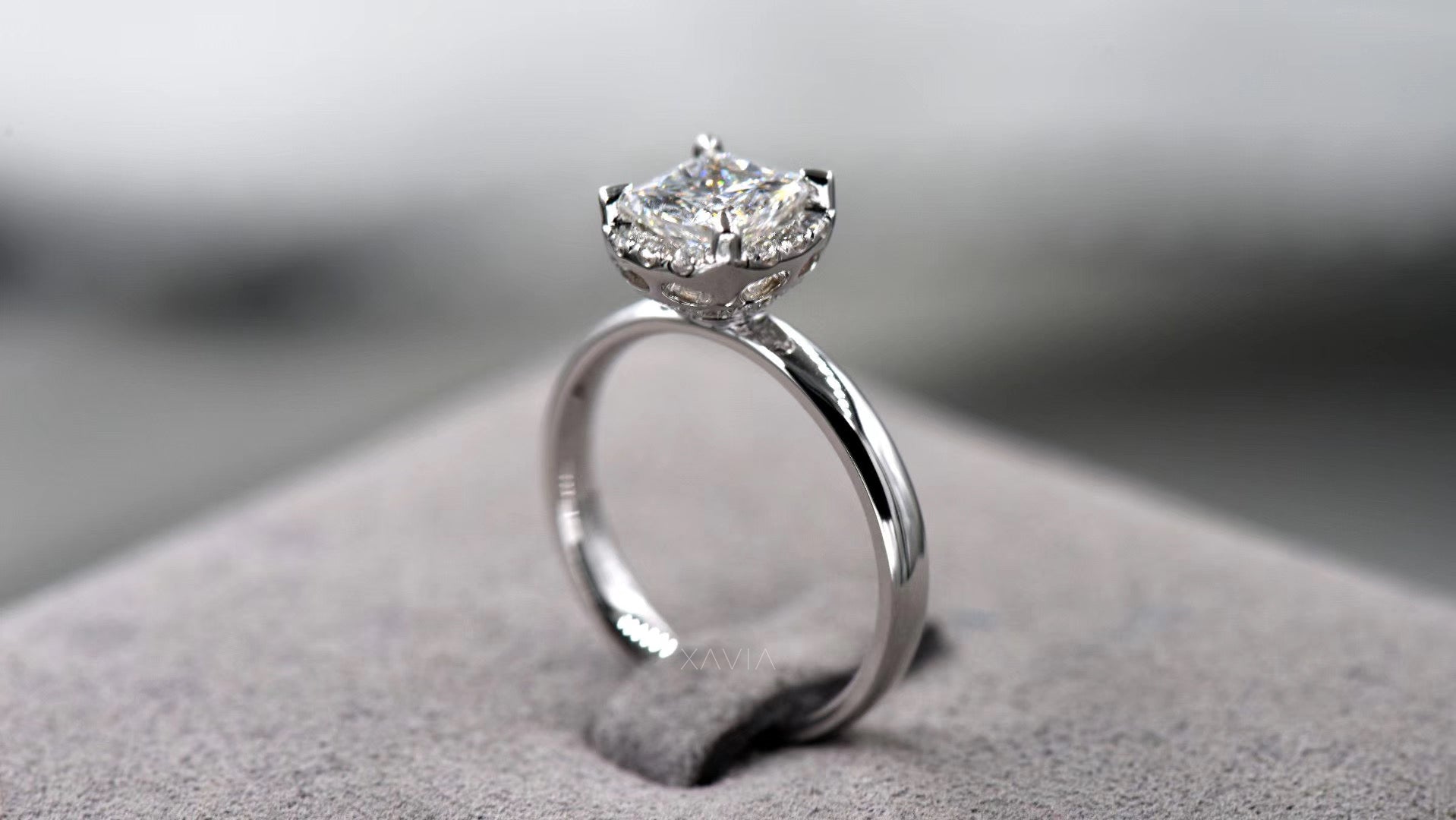 three quarter perspective of princess cut lab diamond ring with curved crescent halo accent diamonds and elegant high polish solitaire band