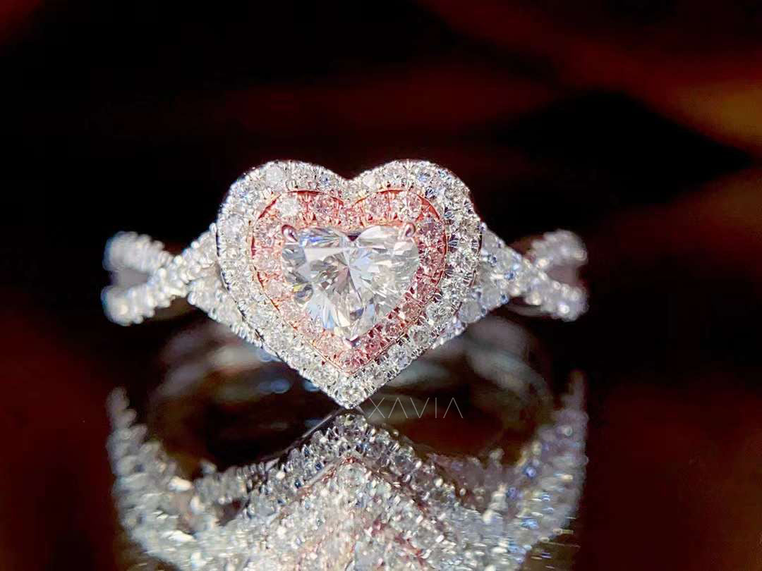 top view of heart cut lab diamond engagement ring with rose gold and white diamond halo, pavé infinity band