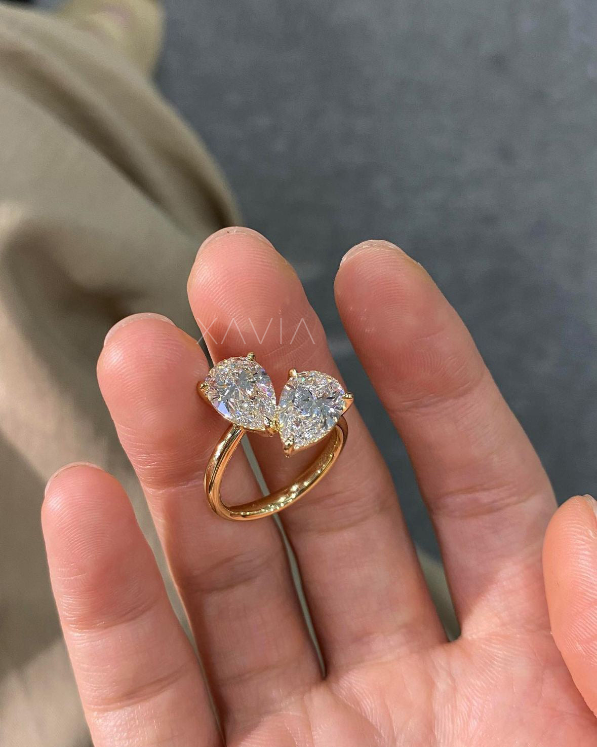 top view of open band toi et moi ring with dual pear cut diamonds