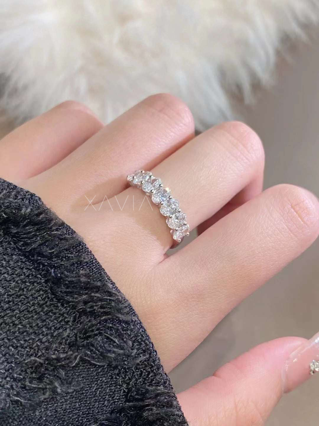 Top view of oval half band worn on hand