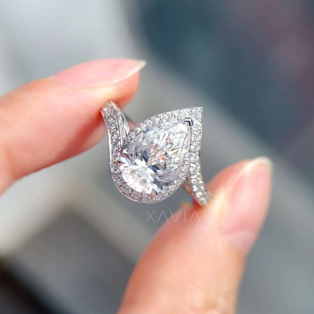 top angle of pear shaped halo ring with split pavé band