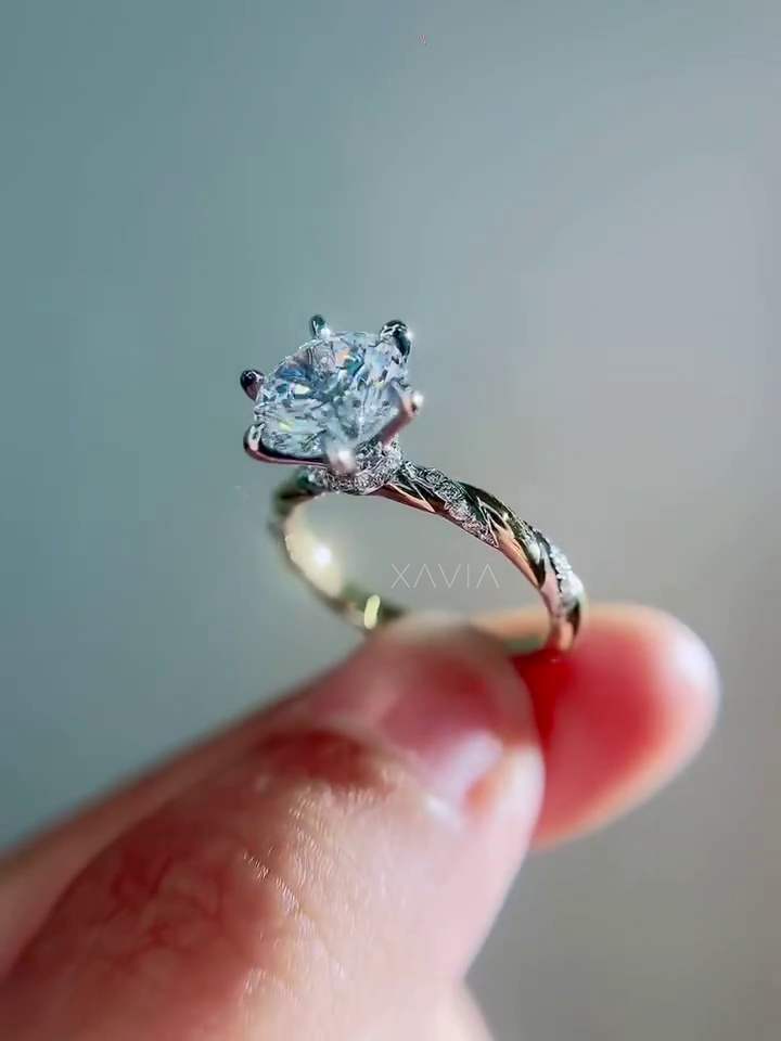 profile view of round brilliant lab diamond engagement ring highlighting sculpted twist band pavé diamonds and elevated solitaire setting