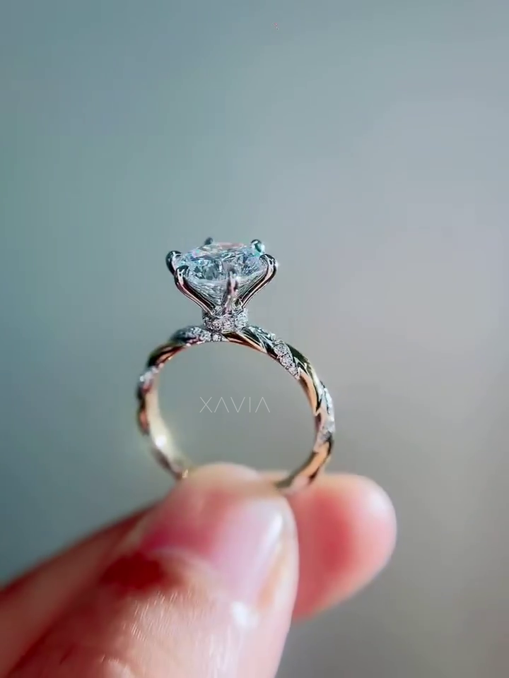 side profile of round brilliant lab grown diamond solitaire engagement ring featuring twisted pavé diamond shank and elegant cathedral style prong setting