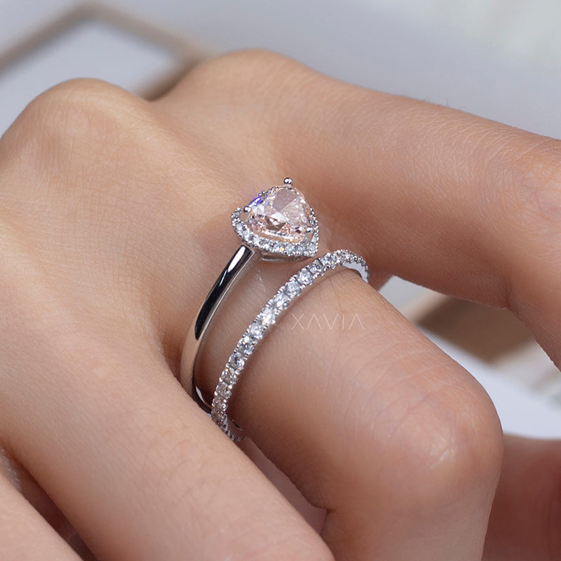 elegant bridal set featuring heart cut lab diamond halo ring and pavé eternity band in white gold on finger