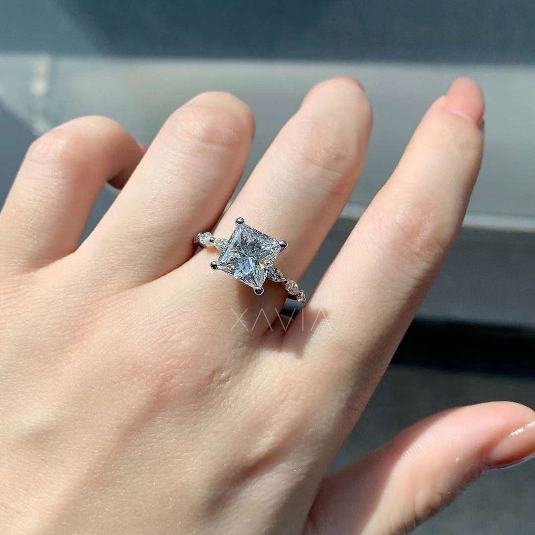 white gold engagement ring with princess cut center stone