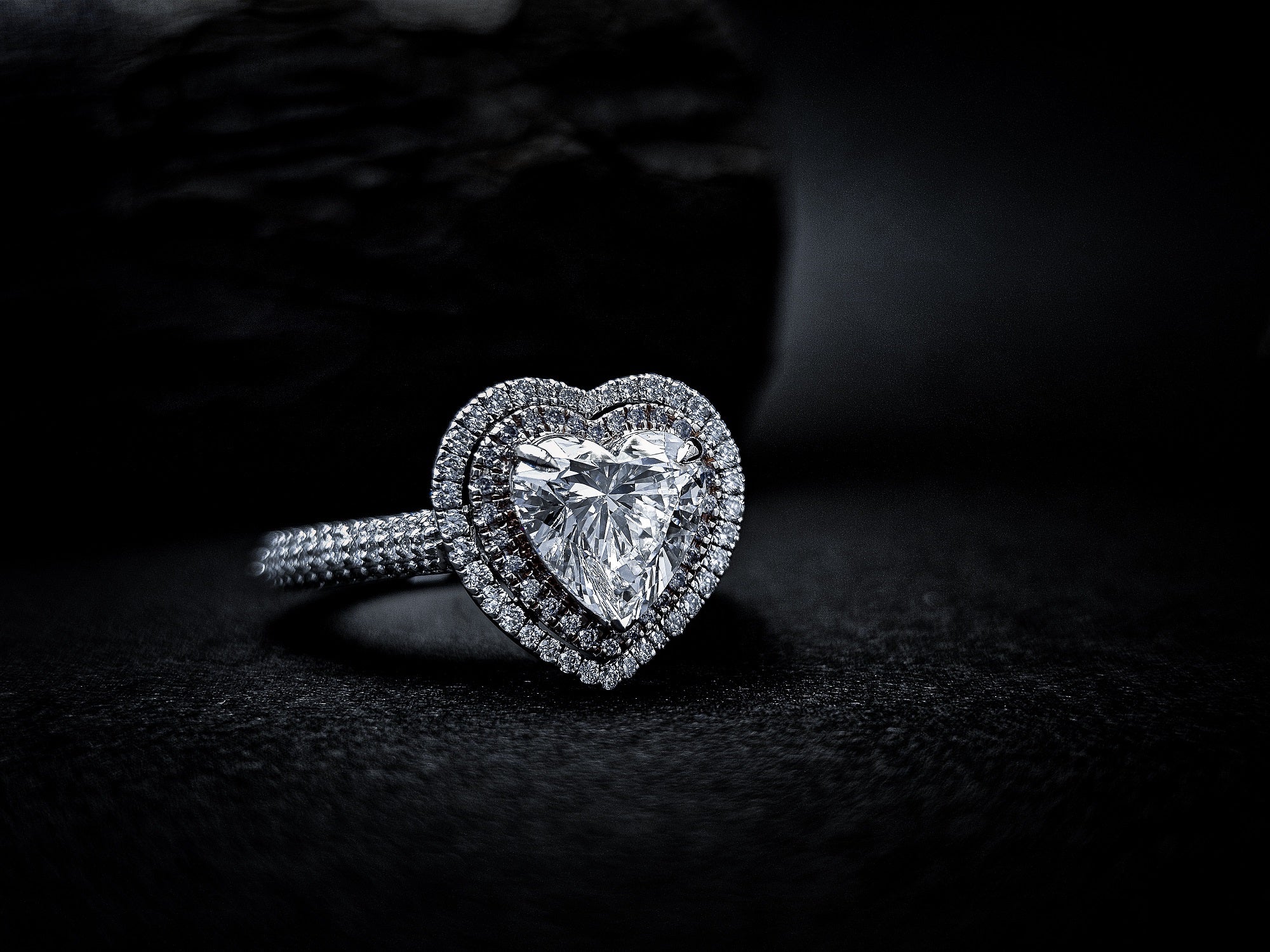 Silver ring with heart-shaped diamond on dark background - Xavia Jewels