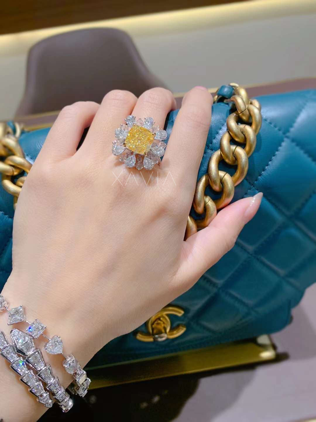 detailed side profile of cushion-cut fancy yellow diamond ring showing pear halo design and handcrafted lab-grown white diamond accents