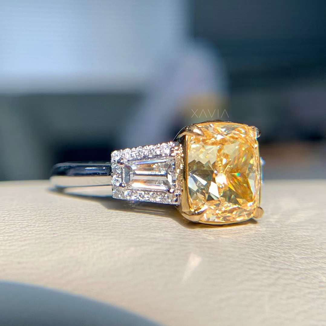 side view of yellow diamond ring with baguette diamonds and halo