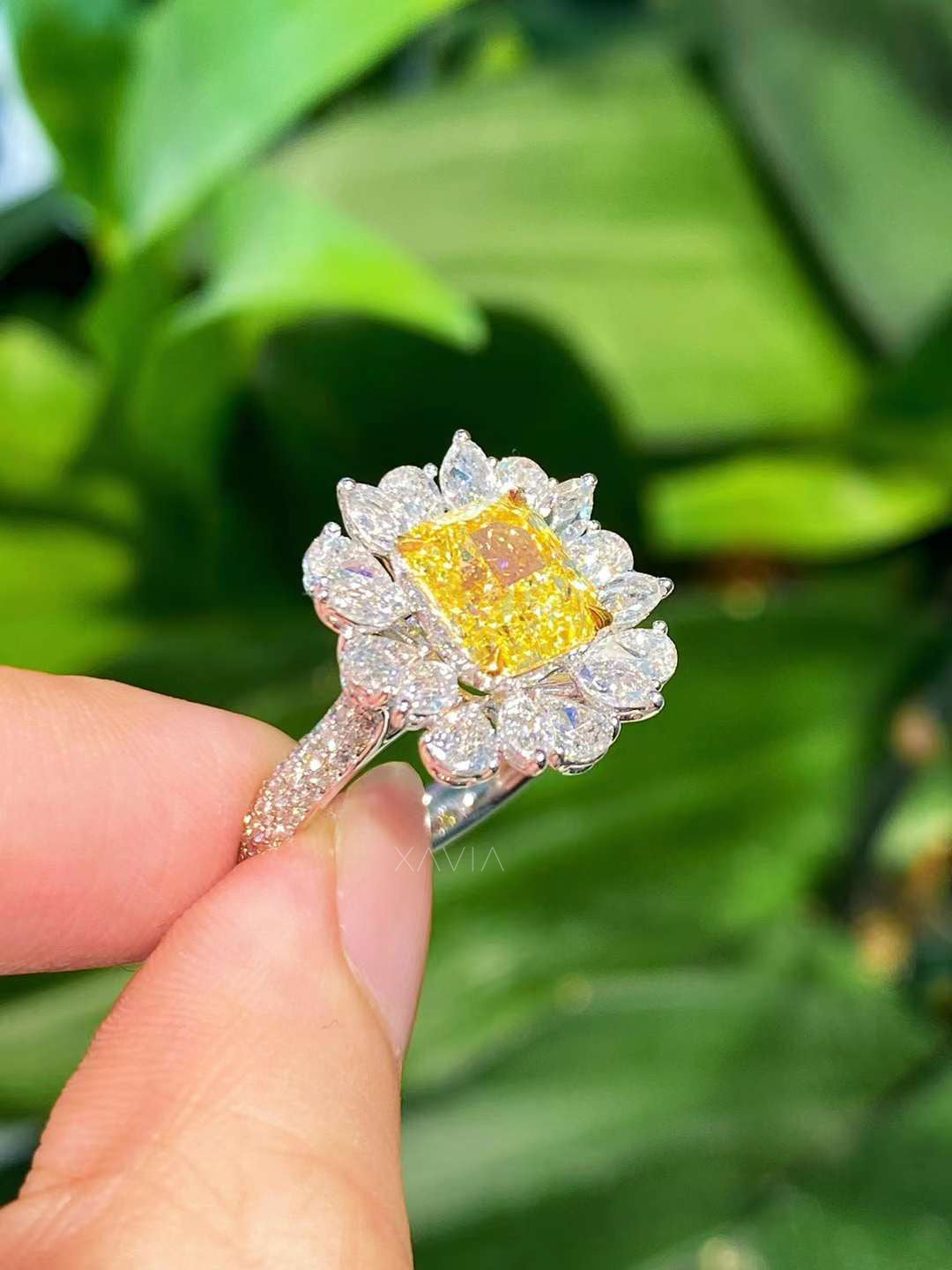 Side profile view of yellow cushion lab diamond engagement ring featuring pavé band and marquise floral halo craftsmanship