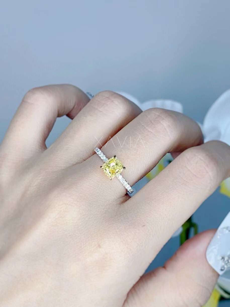 radiant yellow diamond engagement ring worn on hand